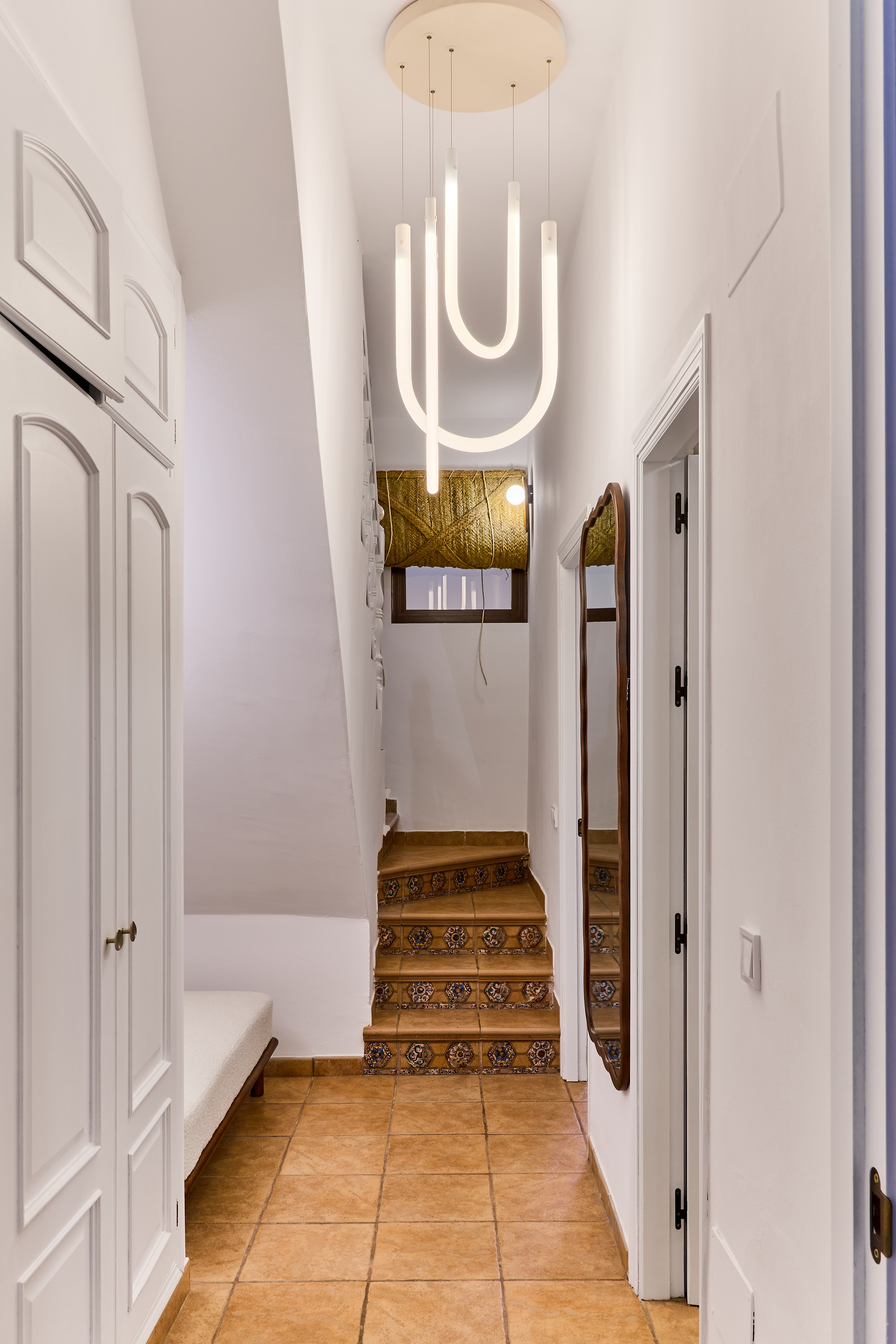 Traditional stairway and whitewashed details at Casa Wanda