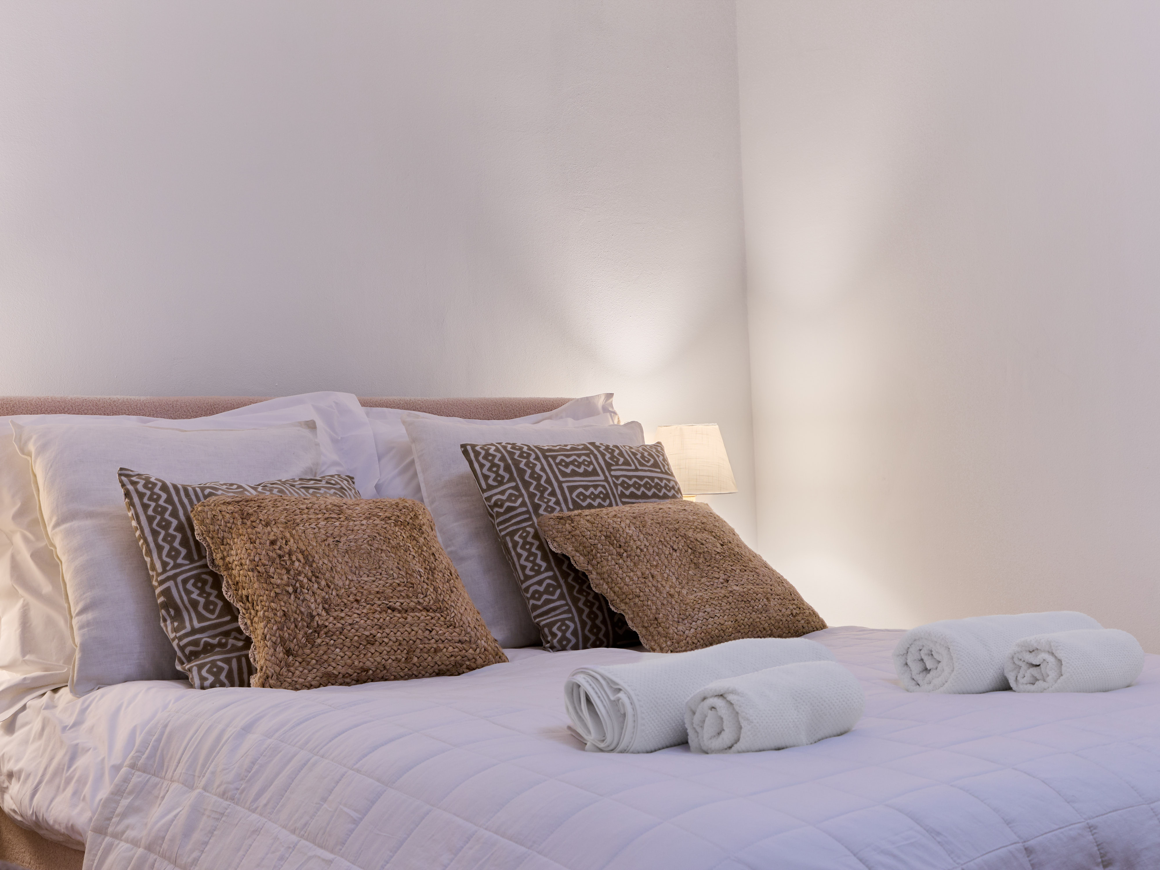 Calm Casa Wanda bedroom with soft neutral bedding