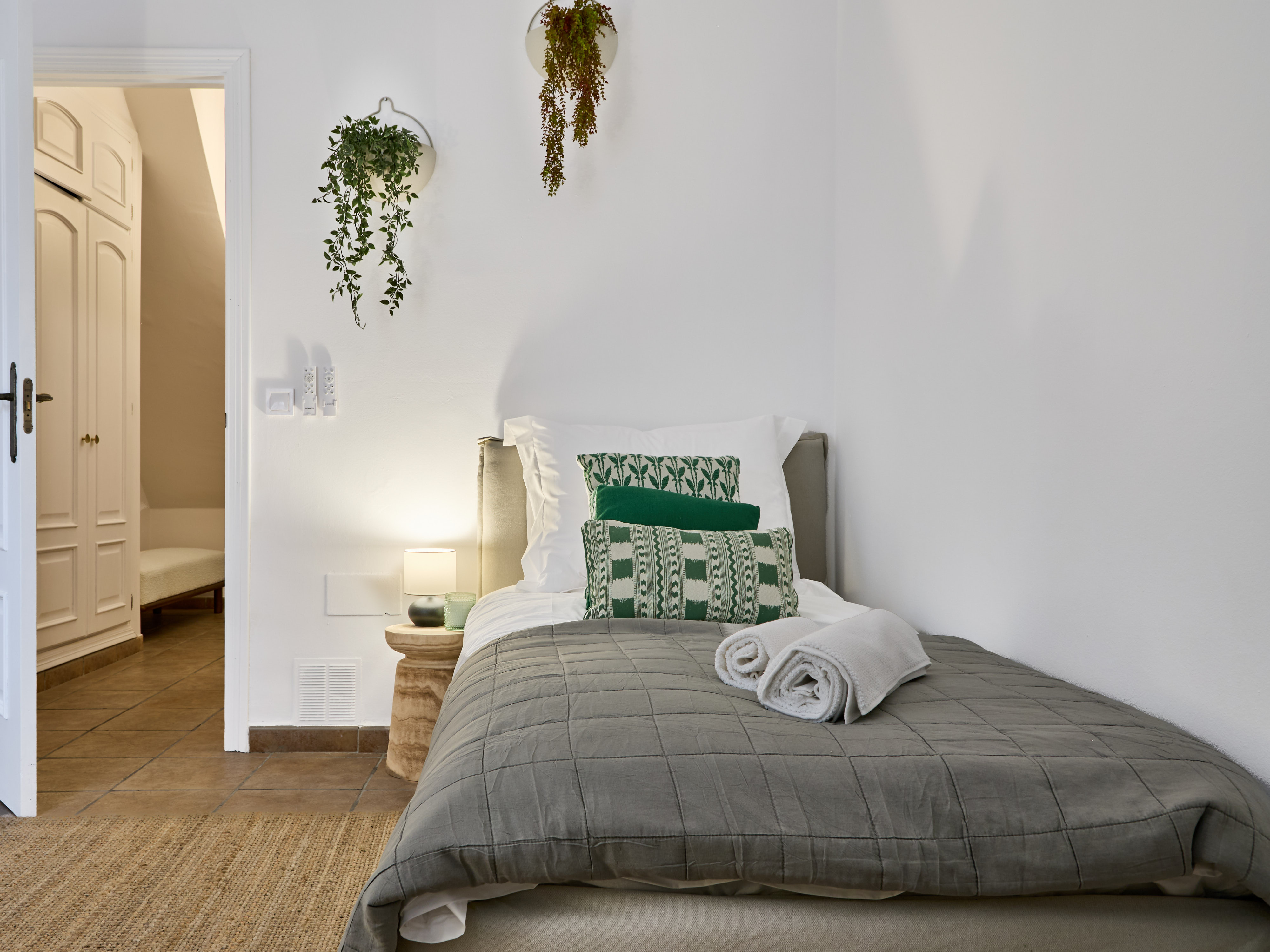 Calm Casa Wanda bedroom with soft neutral bedding