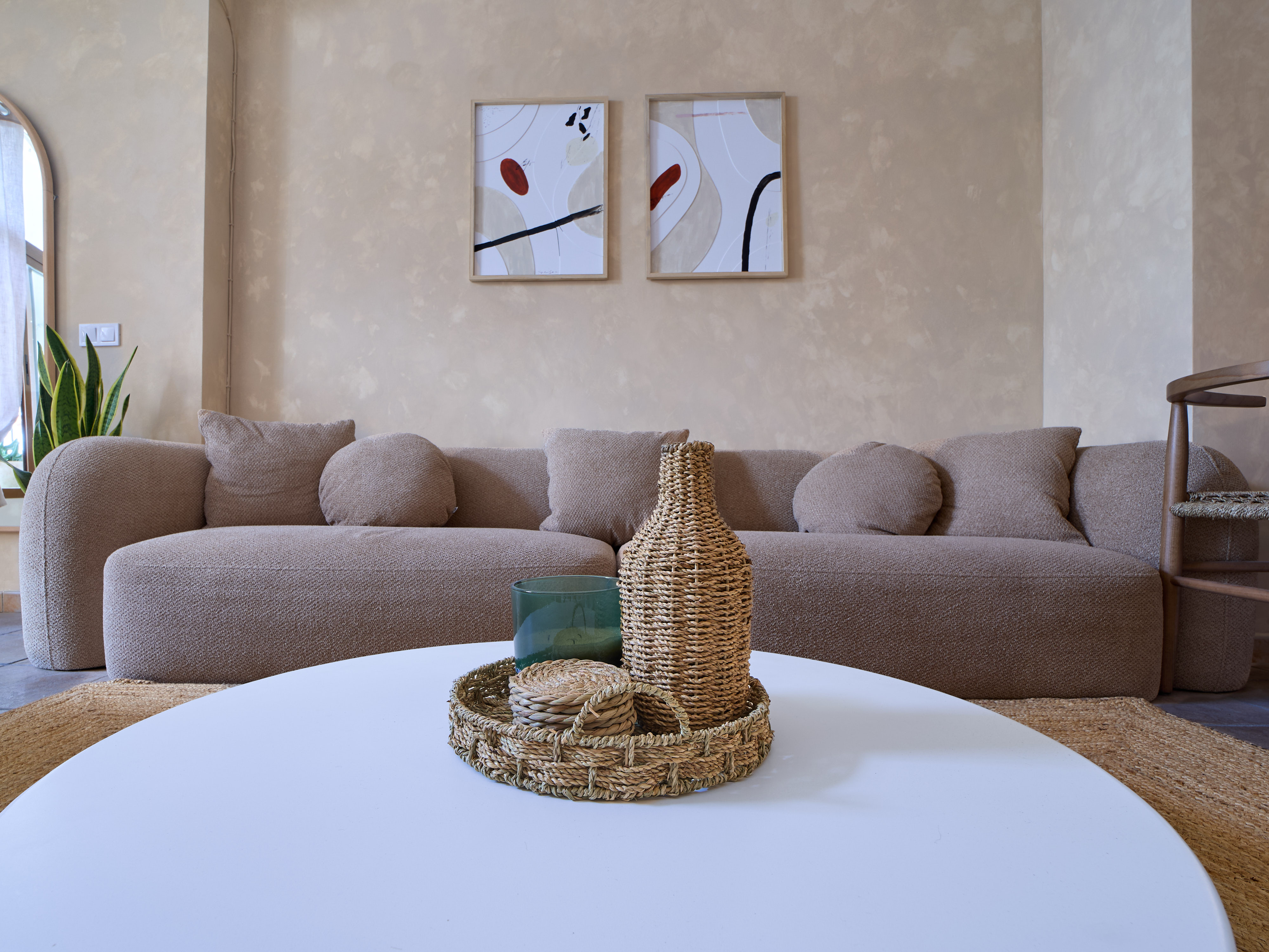 Bright neutral living room at Casa Wanda with natural textures